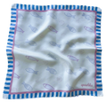 A flat lay view of the apashka Apashka Marina silk bandana laid out fully to show the complete fish pattern and striped border.