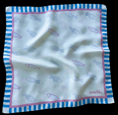A flat lay view of the apashka Apashka Marina silk bandana laid out fully to show the complete fish pattern and striped border.