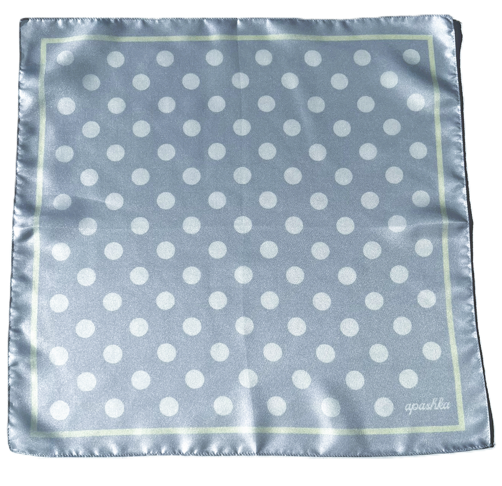 Flat full-view layout of the apashka Bubble-Pop Blu square silk scarf, displaying the symmetrical white polka dot grid pattern on light blue with a pale yellow frame and cursive logo.