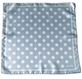 Flat full-view layout of the apashka Bubble-Pop Blu square silk scarf, displaying the symmetrical white polka dot grid pattern on light blue with a pale yellow frame and cursive logo.
