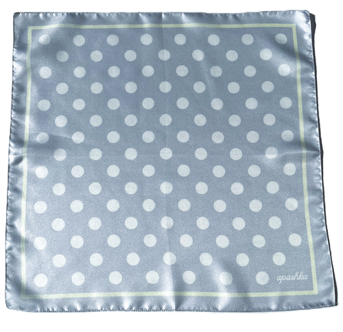 Flat full-view layout of the apashka Bubble-Pop Blu square silk scarf, displaying the symmetrical white polka dot grid pattern on light blue with a pale yellow frame and cursive logo.