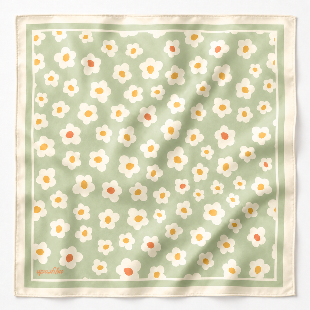 apashka Daisy Daze 100% silk twill 45x45 cm bandana featuring a soft sage green background with retro white and yellow daisies and a cream double-border frame.