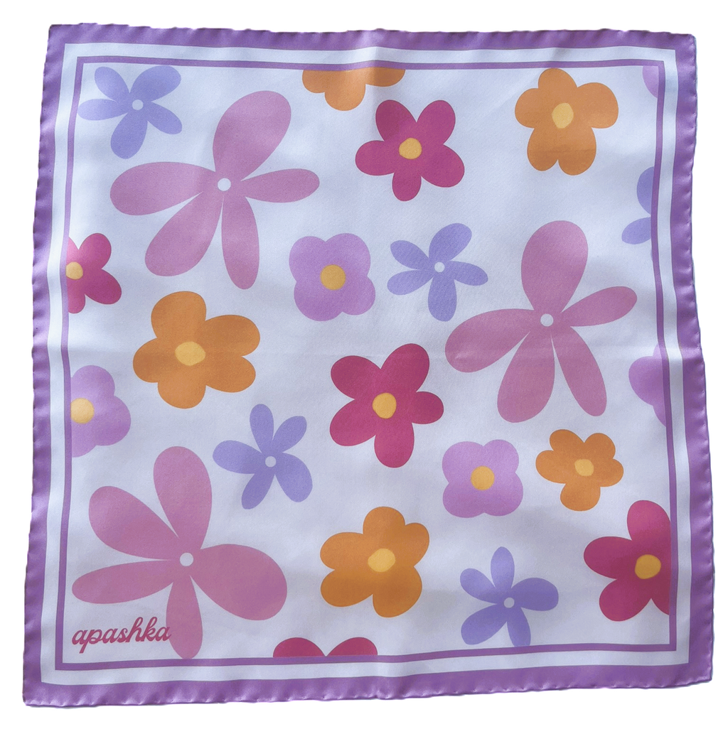 A flat lay view of the apashka Fiori Fuori silk bandana showing the complete retro floral pattern and lilac border frame.