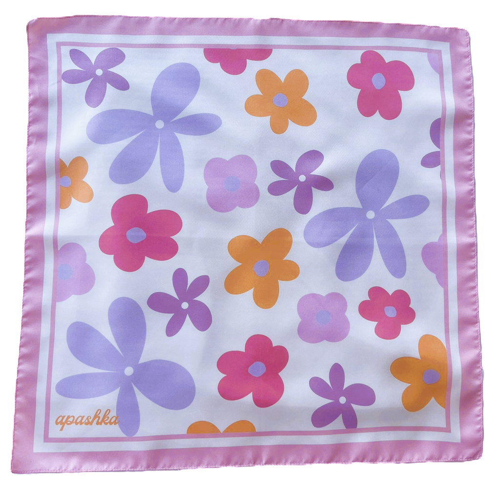 A flat lay view of the apashka Fiori Fuori silk bandana showing the complete retro floral pattern and light pink border frame.