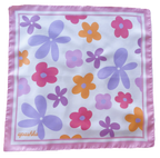 A flat lay view of the apashka Fiori Fuori silk bandana showing the complete retro floral pattern and light pink border frame.