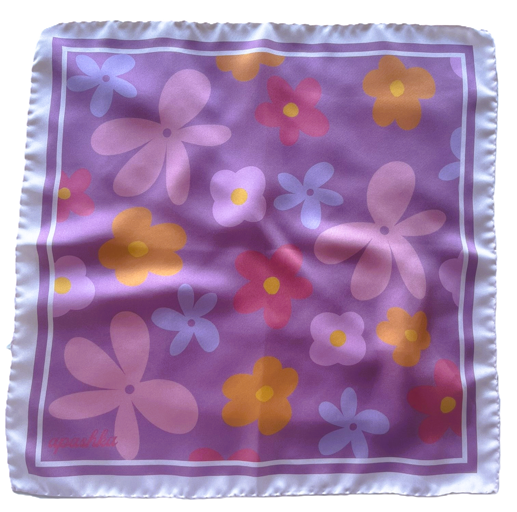 A flat lay view of the apashka Fiori Fuori silk bandana showing the complete retro floral pattern on lavender bckground and lilac cream white frame.