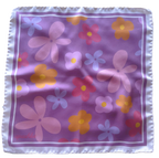 A flat lay view of the apashka Fiori Fuori silk bandana showing the complete retro floral pattern on lavender bckground and lilac cream white frame.