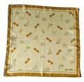 A flat, full-view layout of silk scarf. The scarf displays a repeated pattern of gold orange line-drawn cocktails, citrus wheels, and heart-shaped sunglasses, finished with a solid golden-orange border and the brand name "apashka" in the lower right corner.