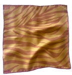 apashka Sunset Safari 100% silk twill 45x45 cm bandana featuring a vibrant orange and neon tangerine zebra print pattern with a hand-rolled hot pink contrast hem.